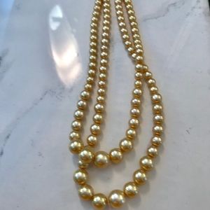 Vintage yellow gold double strand pearls. #madmen